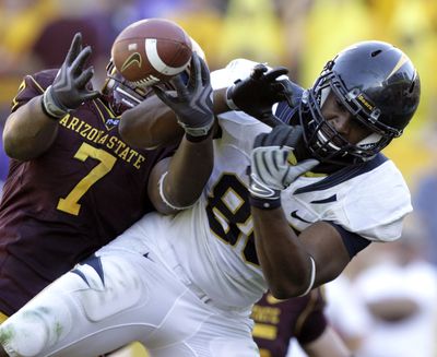 ASU’s Vontaze Burfict, left, breaks up a pass in the end zone meant for California tight end Anthony Miller.  (Associated Press / The Spokesman-Review)