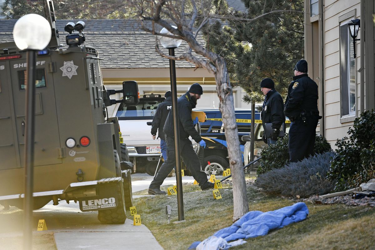 Authorities investigate the shooting of several sheriff’s deputies in an apartment complex in Denver on Sunday. (Helen H. Richardson / Associated Press)