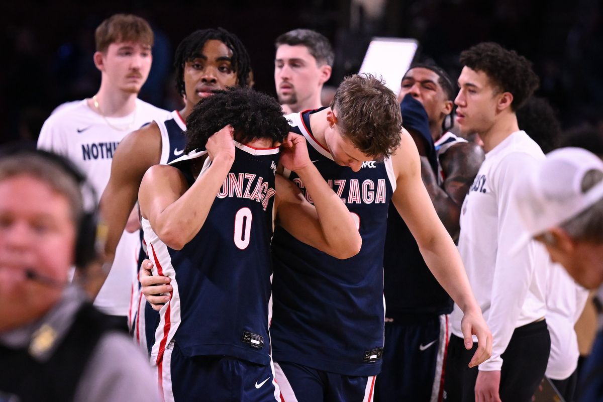 Gonzaga's Ben Gregg puts his arm around guard Ryan Nembhard (0) after the Zags fell to the Houston Cougars in the second round of the NCAA Tournament.  (TYLER TJOMSLAND/THE SPOKESMAN-REVIEW)