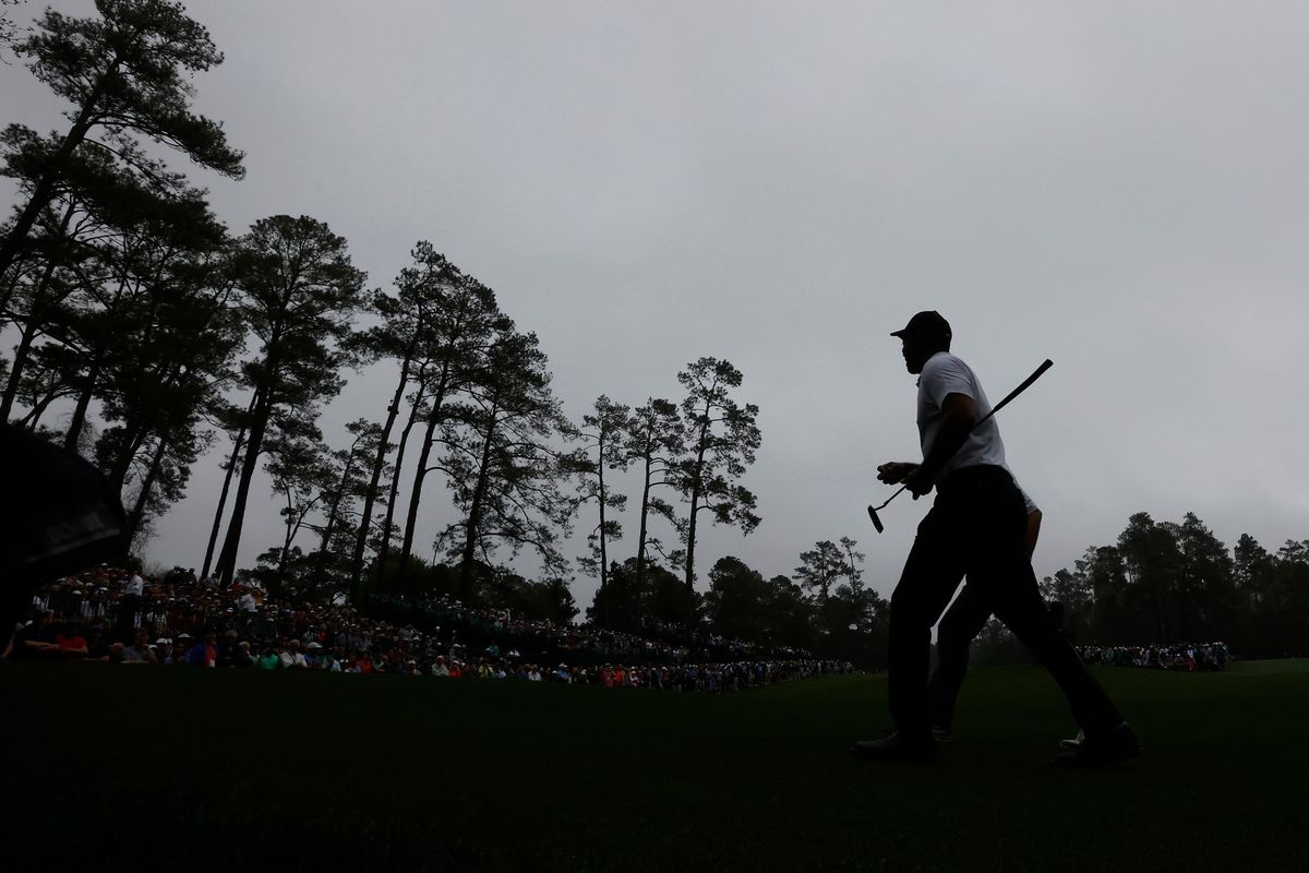 Tiger Woods walks to the 14th tee during his morning practice round for the Masters at Augusta National Golf Club in Augusta, Ga., Wednesday, April 6, 2022.  (Curtis Compton)