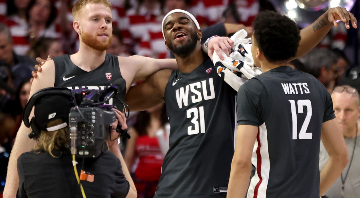Washington State guard Jabe Mullins (3), left, guard Kymany Houinsou (31) and guard Isaiah Watts (12) celebrate for the cameras after upsetting Arizona 77-74 in their Pac 12 game at McKale Center, Tucson, Ariz., February 22, 2024.  (Kelly Presnell / Arizona Daily Star)