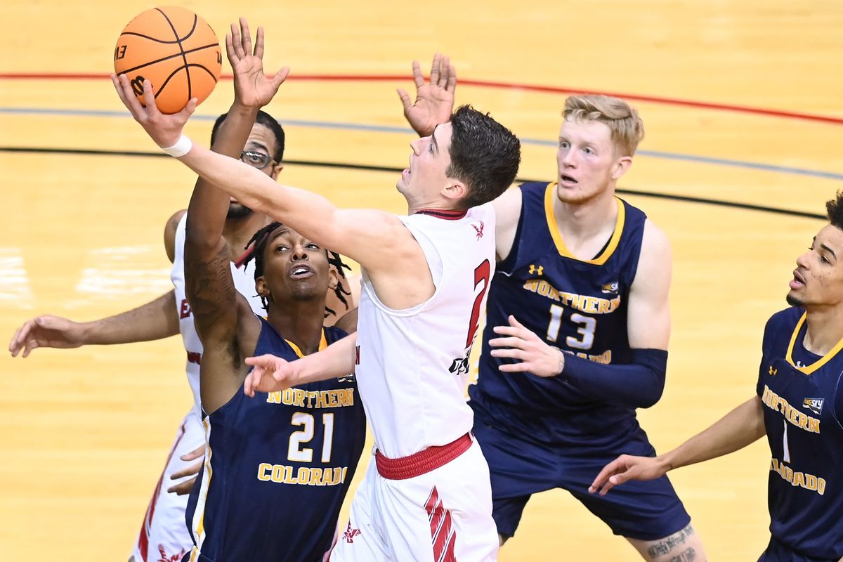 Eastern Washington Eagles guard Steele Venters (2) drives to the hoop against Northern Colorado Bears forward Bryce Kennedy (21) during the first half of a college basketball game on Saturday, Jan 22, 2022, at Reese Court in Cheney, Wash.  (Tyler Tjomsland/The Spokesman-Review)