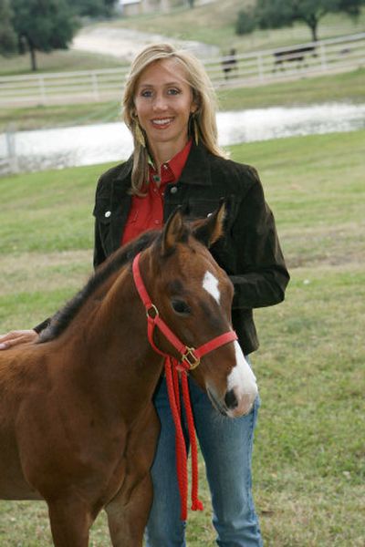 
Barrel racing champion Charmayne James poses with Clayton, the clone of James' gelding Scamper, the retired 10-time world champion. 
 (Associated Press / The Spokesman-Review)