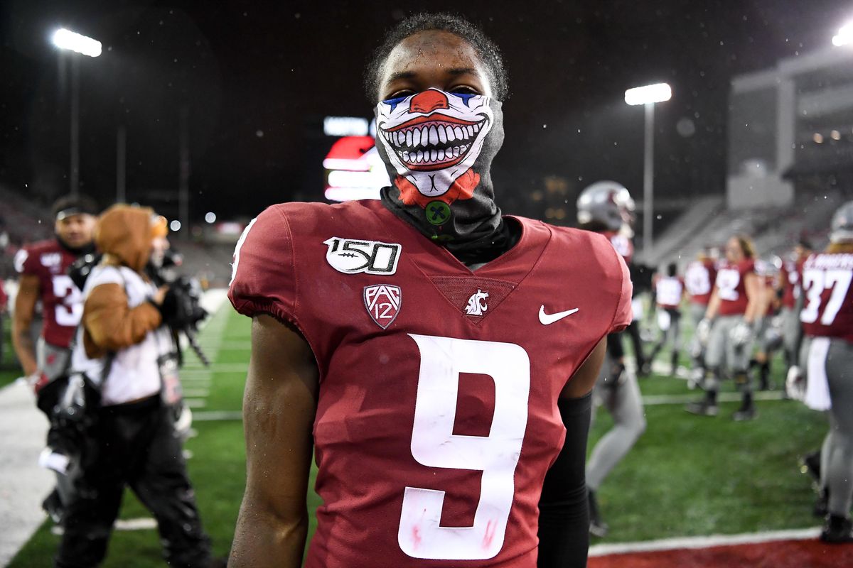 Washington State Cougars wide receiver Renard Bell (9) sports a Joker mask following the second half of a college football game on Saturday, October 19, 2019, at Martin Stadium in Pullman, Wash. WSU won the game 41-10. (Tyler Tjomsland / The Spokesman-Review)