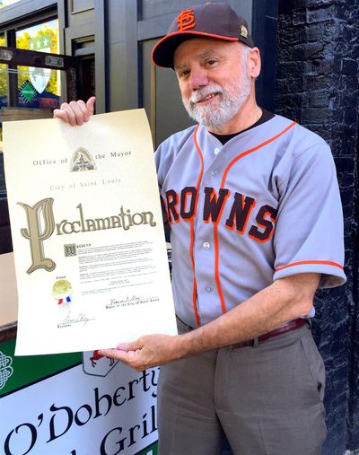 Tom Keefe, founder of the Eddie Gaedel Society, holds a St.Louis mayoral proclamation. (Doug Clark / The Spokesman-Review)