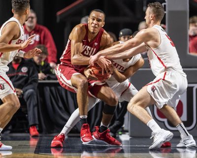 Seattle defenders get Washington State forward Arinze Chidom into a held ball during the first half of an NCAA college basketball game Wednesday, Nov. 14, 2018, in Kent, Wash. (Dean Rutz / AP)