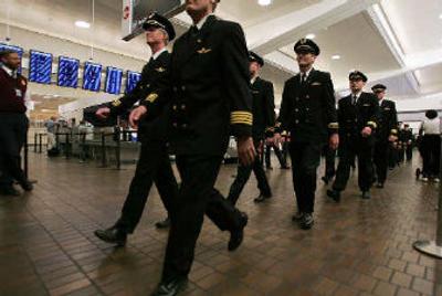 
Some 275 Delta Air Lines Inc. pilots marched through the world's busiest airport Thursday to vent their continued anger over the company's effort to throw out their contract so it can impose up to $325 million in long-term pay and benefit cuts. 
 (Associated Press / The Spokesman-Review)