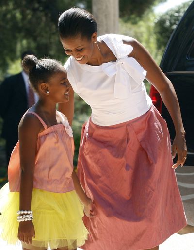 Sasha Obama and her mother,  first lady Michelle Obama, arrive at the Marivent Palace in Palma de Mallorca, Spain, on Sunday. The White House said Michelle Obama was in Spain for a private trip with longtime family friends.  (Associated Press)