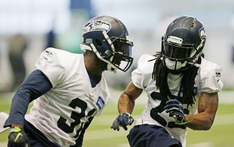 Though their status looked gloomy after the Super Bowl, Seahawks cornerback Richard Sherman, right, and strong safety Kam Chancellor are healthy. (Associated Press)