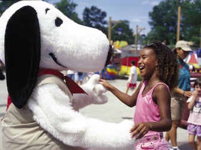 
A girl interacts with the Snoopy character in Camp Snoopy at Cedar Point amusement park/resort in Sandusky, Ohio.
 (Associated Press / The Spokesman-Review)