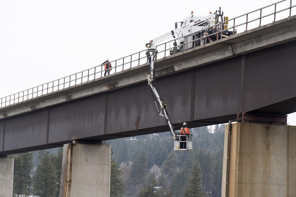 BJ Carter, a BNSF employee, rides in the bucket of a specialized vehicle last Thursday to inspect the sides and bottom of the Latah rail bridge in west Spokane for signs of stress or decay. (Jesse Tinsley / The Spokesman-Review)