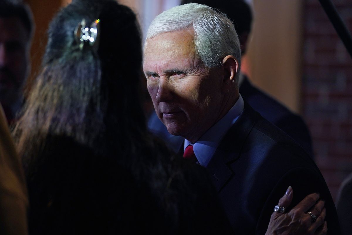 Former Vice President Mike Pence talks with guests during a gathering, Wednesday, Dec. 8, 2021, in Manchester, N.H.  (Charles Krupa)