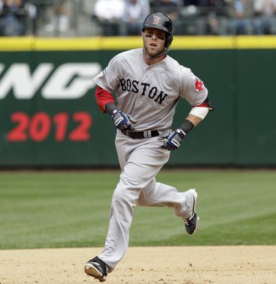 Dustin Pedroia’s solo home run tied it in the eighth for Boston. (Associated Press)