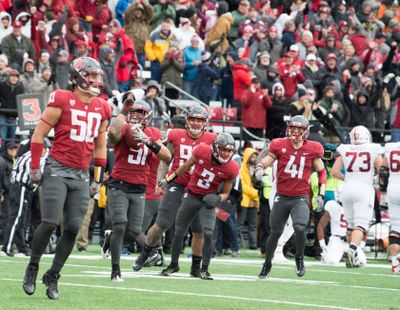 Washington State Cougars linebacker Frankie Luvu (51) reacts after he intercepted the ball from Stanford Cardinal quarterback K.J. Costello (3) to seal the game for WSU during the second half on Saturday. The Cougars were ranked No. 19 in the newest AP Top 25 poll. (Tyler Tjomsland / The Spokesman-Review)