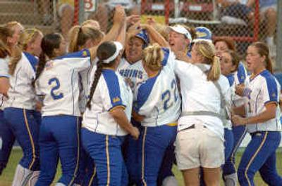 
UCLA players mob teammate Claire Sua, center, wearing helmet, after her game-tying home run in the fifth inning.UCLA players mob teammate Claire Sua, center, wearing helmet, after her game-tying home run in the fifth inning.
 (Associated PressAssociated Press / The Spokesman-Review)