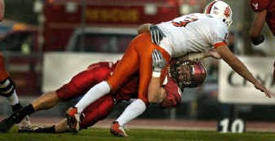 
Joey Cwik brings down Idaho State QB Mark Hetherington in an inspired effort by the EWU defense.
 (Christopher Anderson/ / The Spokesman-Review)