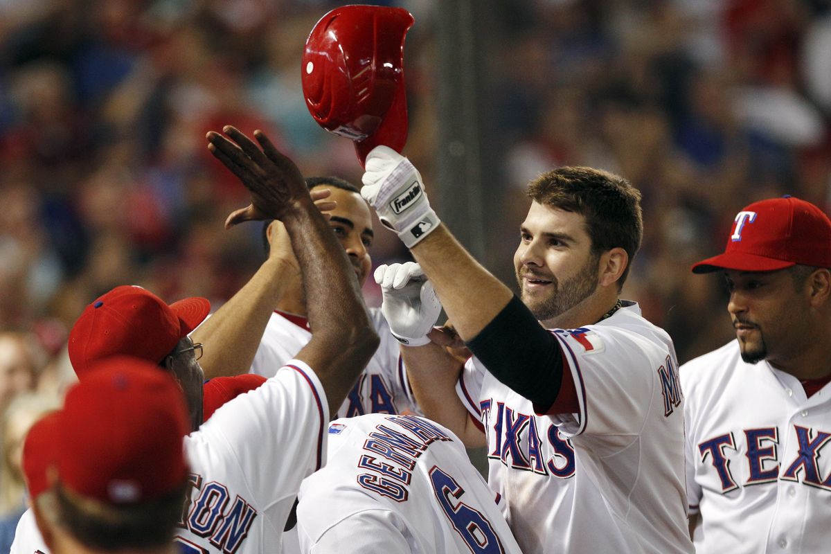 Rangers first baseman Mitch Moreland is congratulated after an eighth-inning home run Saturday. (Associated Press)