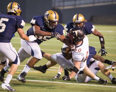 Mead defensive lineman Jonah Jordan says the red turf at Roos Field is one reason he wants to play for Eastern. (Colin Mulvany)