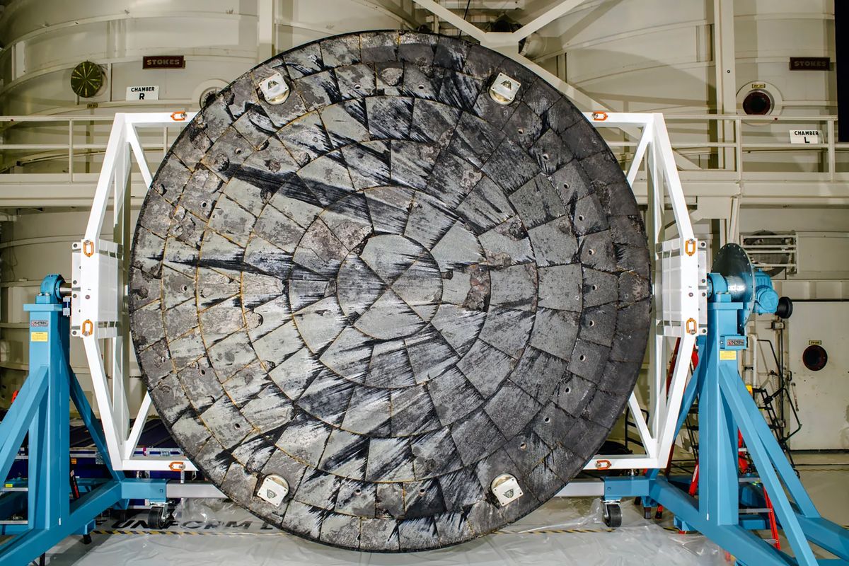 After NASA’s Orion spacecraft was recovered at the conclusion of the Artemis I test flight and transported to NASA’s Kennedy Space Center in Florida, its heat shield was removed from the crew module inside the Operations and Checkout Building and rotated for inspection. (NASA/TNS)