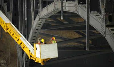 
Minnesota Department of Transportation inspectors examine gusset plates under the DeSoto Bridge on Thursday. Associated Press
 (Associated Press / The Spokesman-Review)