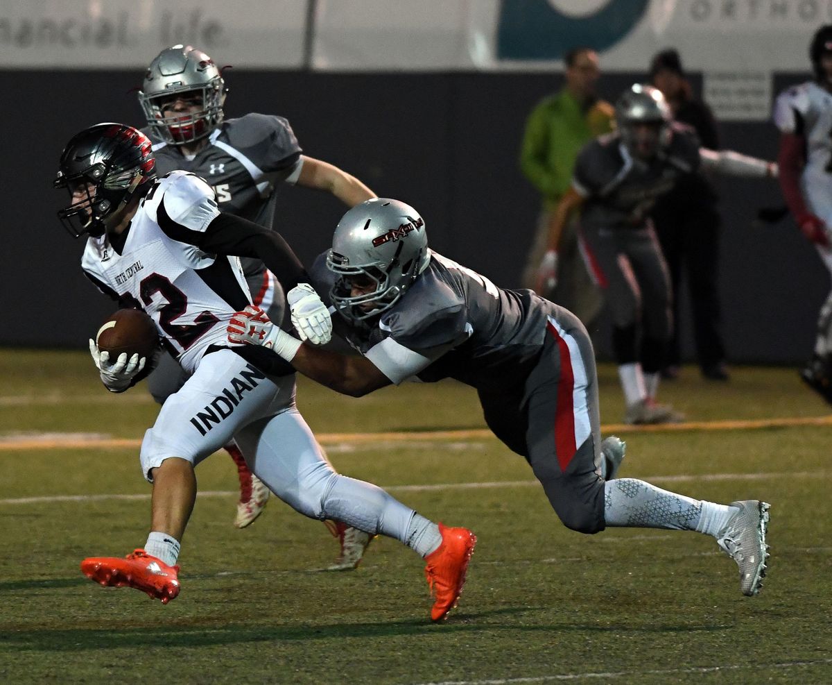 North Central wide receiver Jake Healy (22) is tackled by Ferris linebacker Koran Burks (50) during the first half of a high school football game at Joe Albi Stadium, Friday, Sept. 23, 2016, in Spokane, Wash. (Colin Mulvany / The Spokesman-Review)