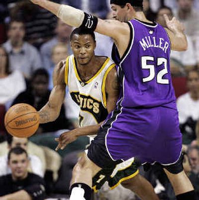 
Seattle SuperSonics forward Rashard Lewis drives around Sacramento Kings center Brad Miller in the first half Tuesday during the second game of the teams' best-of-7 series. 
 (Associated Press / The Spokesman-Review)