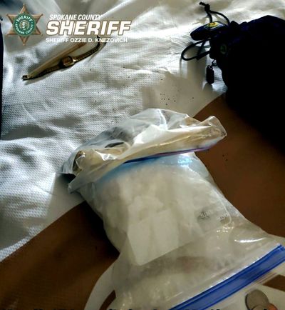The Spokane County Sheriff's Office seized two handguns, about one pound of methamphetamine, one-half pound of heroin, 1,000 or more fentanyl pills and over $7,000 in cash from Phillip J. Motyka Jr. late last month, deputies said.   (COURTESY OF SPOKANE COUNTY SHERIFF'S OFFICE)