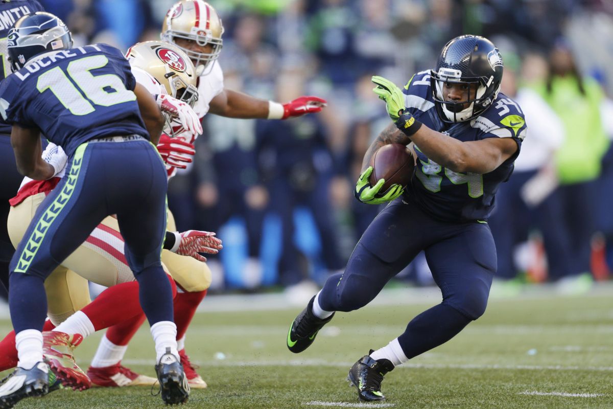The health of running back Thomas Rawls, right, is a big question as the Seattle Seahawks begin their training camp. (John Froschauer / Associated Press)