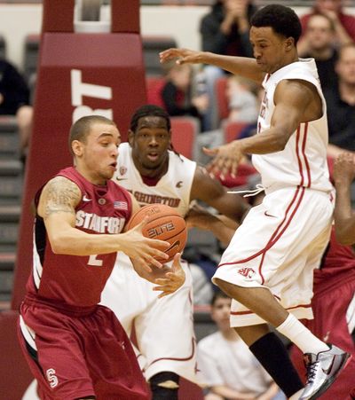 Stanford’s Aaron Bright, left, gets a steal as WSU’s Faisal Aden, right, and DeAngelo Casto can’t recover. (Associated Press)