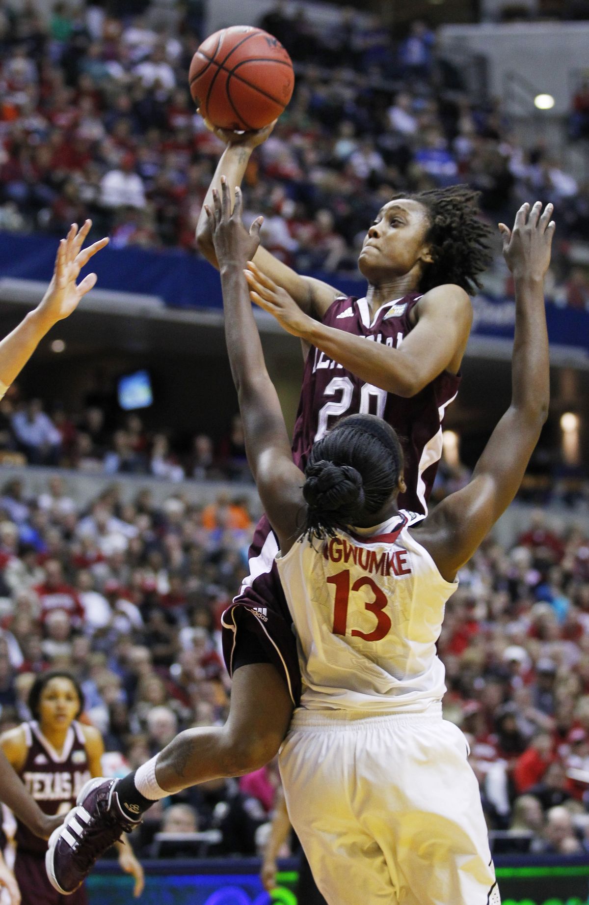 Texas A&M’s Tyra White shoots over Stanford’s Chiney Ogwumike in the second half. (Associated Press)