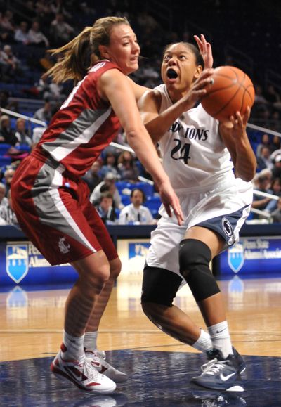 Cougars senior Rosie Tarnowski, left, is averaging 5.3 ppg in four starts. (Associated Press)