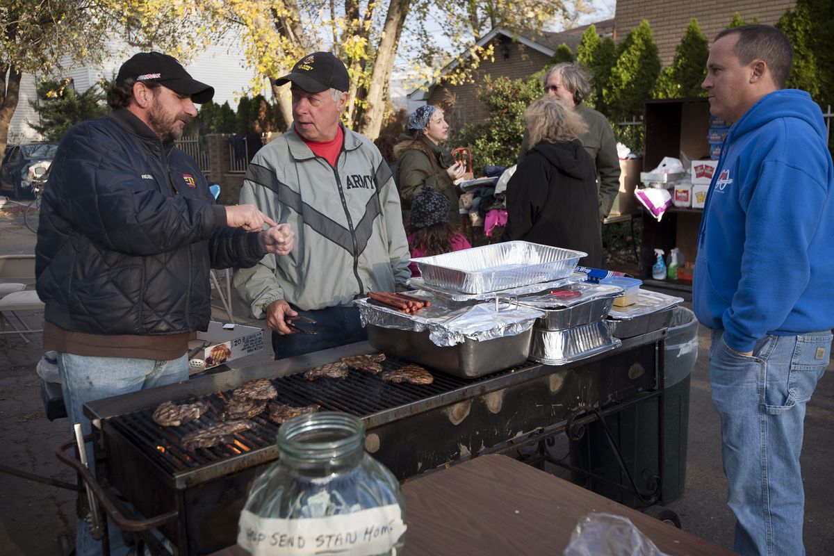 Joe Rubino, from left, Gary Wells and Ken Twist man the grill as they pick up donations from area businesses Sunday, Nov. 4, 2012, in Little Ferry, N.J. (Amy Newman / The Record Of Bergen County)