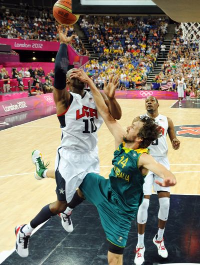 Australia’s Matt Nielsen tries to stop Kobe Bryant of the United States in Wednesday’s quarterfinal. (Associated Press)