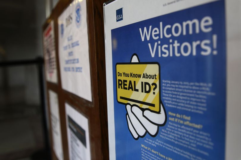 In this photo taken April 6, 2016, a sign at the federal courthouse in Tacoma is shown to inform visitors of the federal government’s REAL ID act, which requires state driver’s licenses and ID cards to have security enhancements and be issued to people who can prove they’re legally in the United States. (Ted S. Warren / Associated Press)