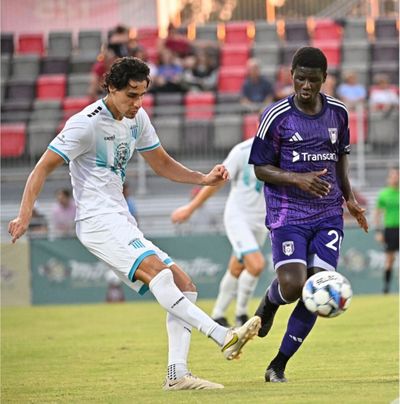 Velocity defender Marcelo Lage makes a pass in front of Chattanooga forward Ropapa Mensah during a Jagermeister Cup match in Chattanooga, Tennessee, on Wednesday.  (Courtesy of Spokane Velocity)