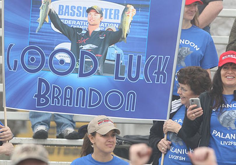 Family and friends gather at the Louisiana Delta boat launch near New Oreleans to cheer for Brandon Palaniuk, 23, of Rathdrum, Idaho, as he launches for the second day of the three-day Bassmaster Classic.   (James Overstreet / Bassmaster Classic)