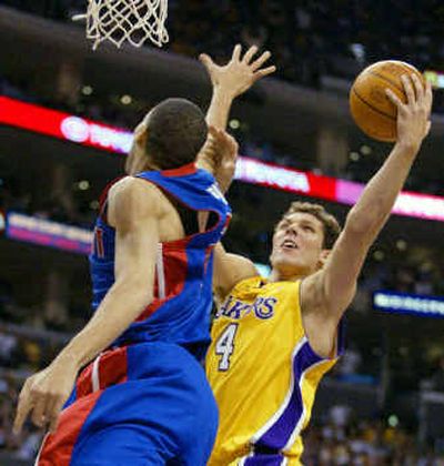 
Los Angeles' Luke Walton (4), the only white American player in the NBA finals, drives to the basket against Detroit's Tayshaun Prince.
 (Associated Press / The Spokesman-Review)