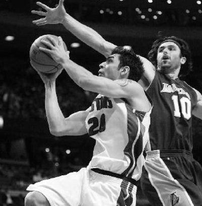 
Carlos Delfino  and the Detroit Pistons drove past the Los Angeles Lakers. 
 (Associated Press / The Spokesman-Review)