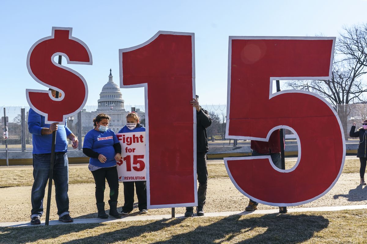 Activists appeal for a $15 minimum wage Thursday afternoon near the Capitol in Washington, D.C.  (J. Scott Applewhite)