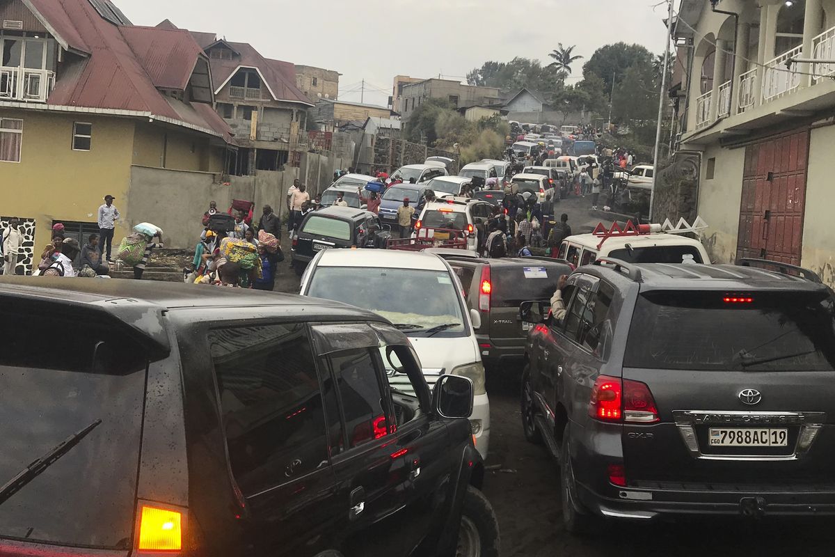 Traffic clogs a main road as residents try to flee Goma, Congo, Thursday, May 27, 2021 , five days after Mount Nyiragongo erupted. Evacuation orders were given to most of the town, fearing further eruptions and tremors.  (Moses Sawasawa)