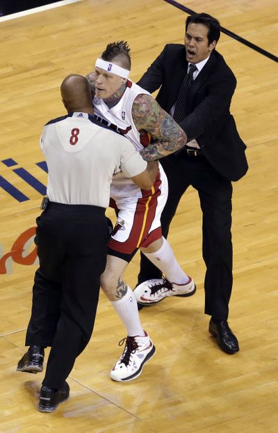 Official Marc Davis and Heat coach Erik Spoelstra restrain Miami’s Chris Andersen during the first half. Anderson earned a technical and a flagrant foul for pushing the Pacers’ Tyler Hansbrough twice. (Associated Press)