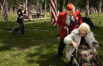 
Retired Lt. Col. Dean Ladd, 83, a WWII vet, wheels Vera Ladd, 83, to their car after the Memorial Day service at Fairmount Memorial Cemetery on Monday. Retired Lt. Col. Dean Ladd, 83, a WWII vet, wheels Vera Ladd, 83, to their car after the Memorial Day service at Fairmount Memorial Cemetery on Monday. 
 (Jed Conklin photos/Jed Conklin photos/ / The Spokesman-Review)
