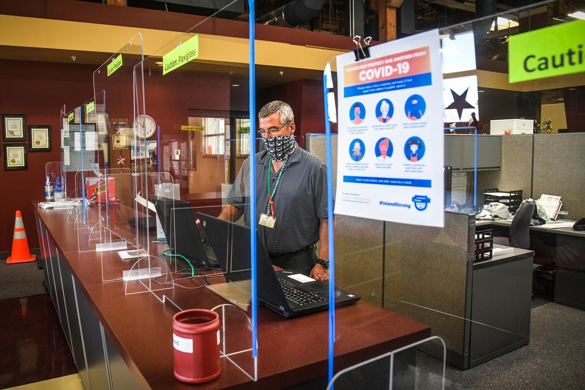 The public front desk area at the Spokane County Elections Office now features plexiglass barriers, as seen  (DAN PELLE/THE SPOKESMAN-REVIEW)
