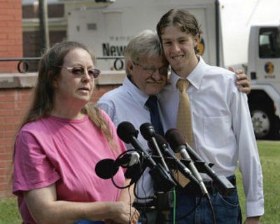 
Starchild Abraham Cherrix, right, gets a hug from his father, Jay, as his mother, Rose, left, talks to the press after a hearing at the Accomack County Courthouse in Accomac, Va., on Wednesday.
 (Associated Press / The Spokesman-Review)