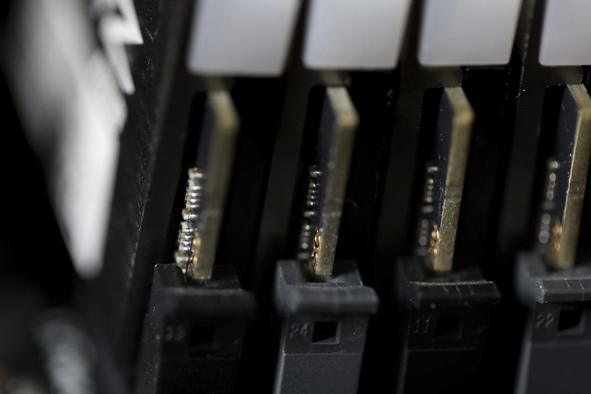 FILE - This Feb 23, 2019, file photo shows the inside of a computer in Jersey City, N.J. Cybersecurity teams worked feverishly Sunday, July 4, 2021, to stem the impact of the single biggest global ransomware attack on record, with some details emerging about how the Russia-linked gang responsible breached the company whose software was the conduit. An affiliate of the notorious REvil gang, infected thousands of victims in at least 17 countries on Friday, largely through firms that remotely manage IT infrastructure for multiple customers, cybersecurity researchers said.  (Jenny Kane)