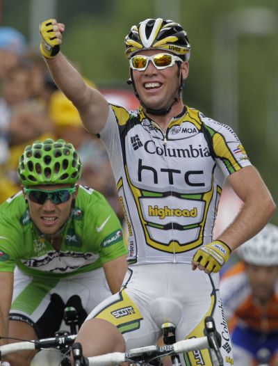 Mark Cavendish, right, reacts as he crosses the finish line to win the 19th stage of the Tour de France. (Associated Press / The Spokesman-Review)
