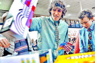 
Canfield Middle School eighth-grader Austin Forte checks out a lava lamp during the Pays to Get A's assembly at the school.  Students receive prizes for A's on their report card. 
 (Kathy Plonka / The Spokesman-Review)