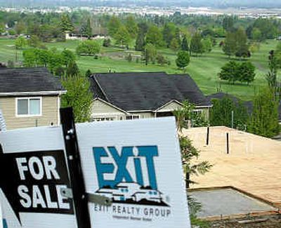 
 New homes are shown being built next to Cedar Links Golf Course in Medford, Ore. Golf course conversions have become a nationwide trend in recent years as the value of residential land and the number of golf courses climbed while the number of rounds played declined. 
 (Associated Press / The Spokesman-Review)