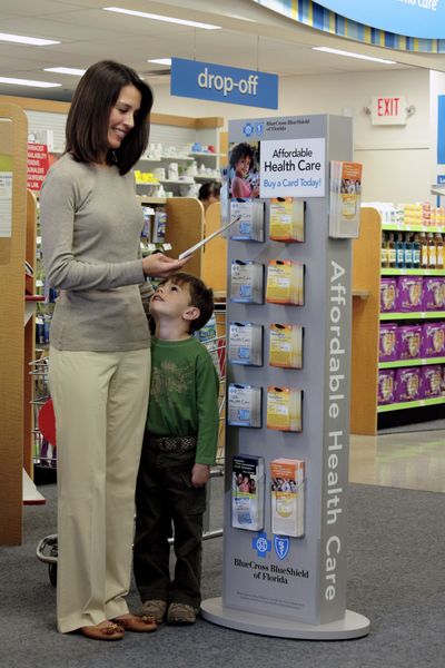 A rack of health care gift cards are shown at a CVS store. Several health care companies are rolling out gift cards similar to those offered by retail stores and restaurants. Some can be used to pay bills or insurance premiums while others give holders discounts on specific services or purchases.Courtesy of Blue Cross and Blue Shield of Florida (Courtesy of Blue Cross and Blue Shield of Florida)