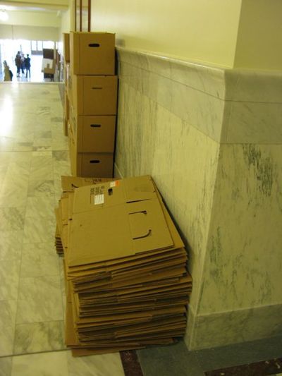 Boxes are stacked in the hallway in the Garden Level of the state capitol, but a brief flurry of hope Thursday that the legislative session could be wrapped up by Friday was dashed by the end of the day, with both House and Senate leaders conceding they'll likely be back on Monday. (Betsy Russell)